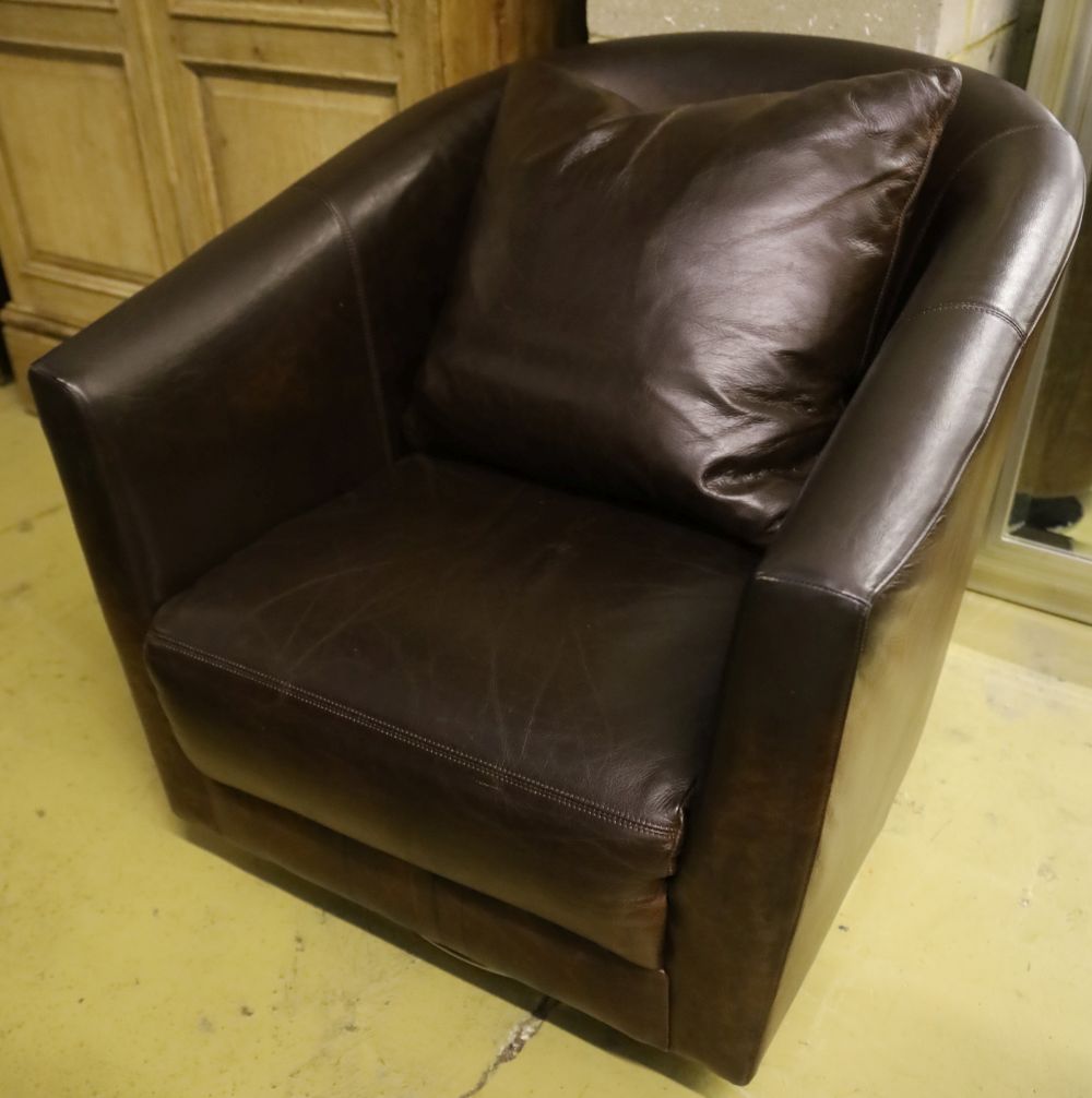 A modern brown leather swivel armchair